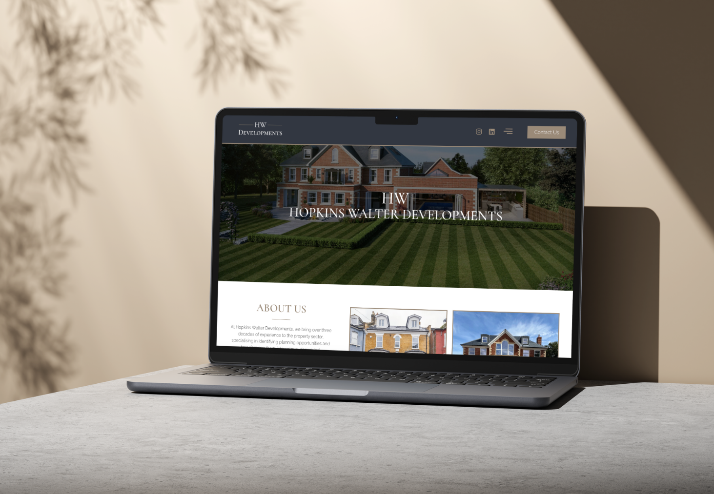 Hopkins Walter Developments website shown on a laptop
